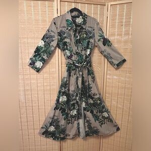 Shirtdress w/ crisp lines & floral purple, white & deep green & brown stripes.